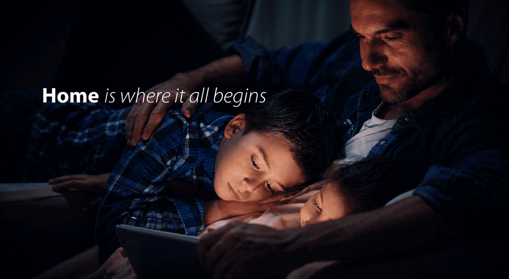 Family caring for elderly at home using digital health tools.