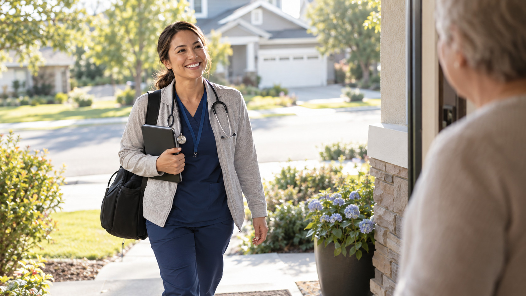 Homecare nurse smiling at elderly patient outside home. HCHB